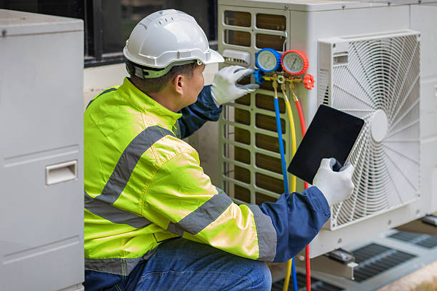 Professional Heat Pump Repair technician working in Waldron, AR